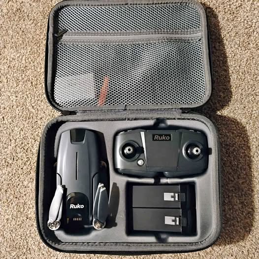 Foldable drone kit in hard case with controller and two batteries