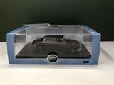 Diecast limousine model in clear display case, dark maroon vehicle on stand.