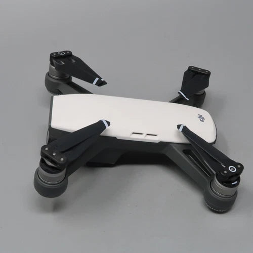 DJI Spark quadcopter drone with 2-axis gimbal camera, white body, front arms and propellers