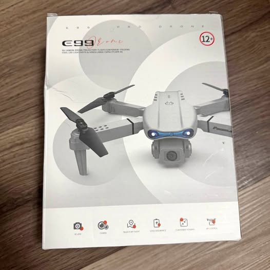 Drone with cameras retail box showing quadcopter with camera