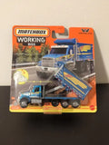 Matchbox Working Rigs Western Star 49X dump truck diecast on retail package, blue and silver