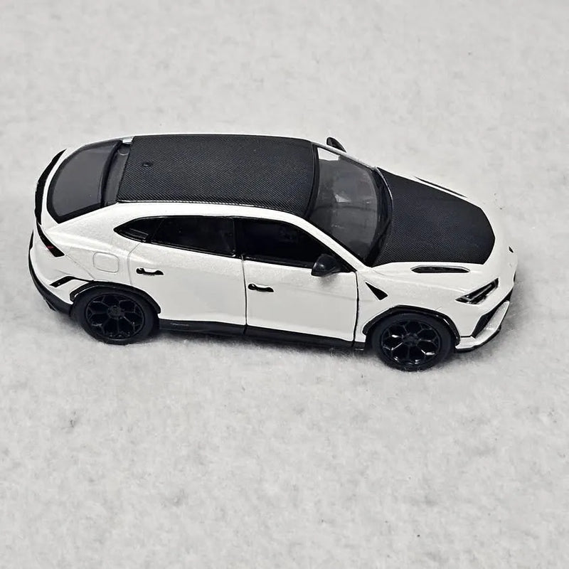 White diecast model car, Lamborghini Urus Performante, side view, 1:40 scale