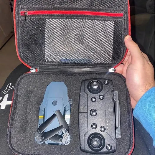 Compact folding drone and remote controller in a hard zippered carrying case