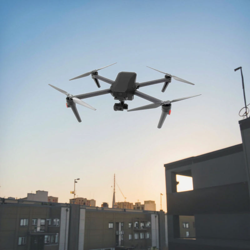 Folding quadcopter drone with camera, gray body, four propellers