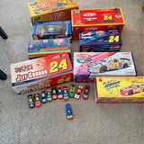 Lot of Jeff Gordon #24 diecast cars with boxed packaging and several loose cars