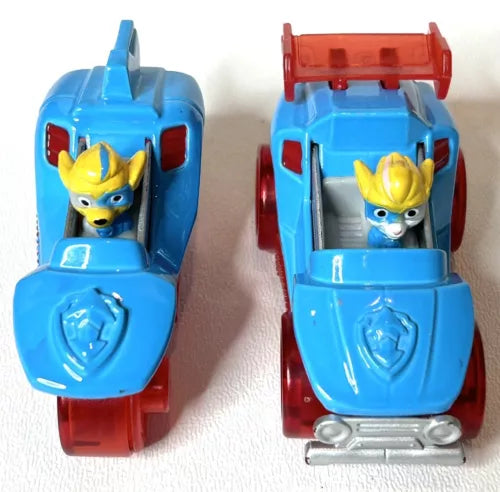 Blue and red diecast twin car toy with yellow-eared pup figure, open cockpit