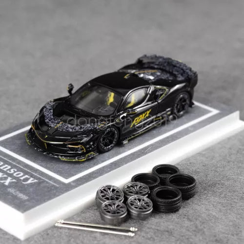 1/64 scale black diecast sports car with decals, wheels, and included parts