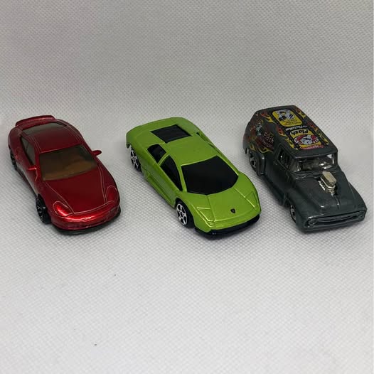 Diecast toy car set of 3: red, lime green, and dark gray/black collectible cars