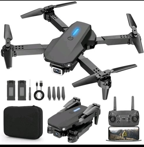 Foldable beginner drone with camera, four propellers, remote and accessories in black case