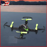 RC mini quadcopter drone with glowing green LED lights and four propellers