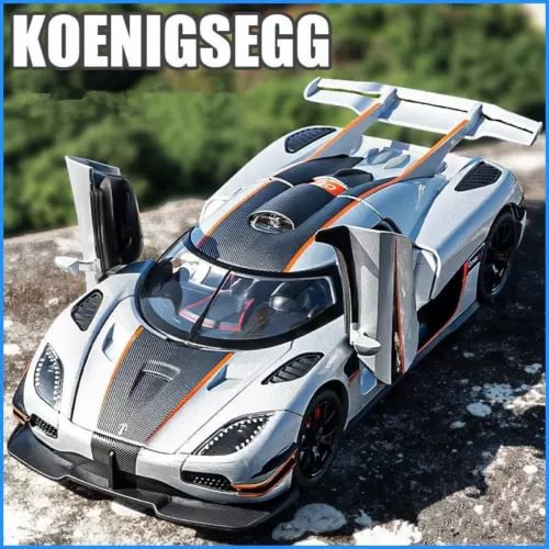 Alloy sports car diecast model with open cockpit, white body and orange accents, front 3/4