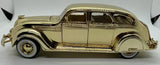 Gold-plated 1936 Chrysler Airflow diecast toy car, side view, 1/36 scale