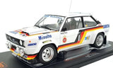 Diecast rally car model, white with blue and orange stripes, #1 decals on display base