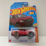 Red Hot Wheels 2020 Toyota Tacoma diecast truck in blister pack