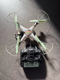 RC quadcopter drone with Grogu Baby Yoda figure, green rotors and silver frame