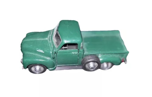 Green diecast pickup truck with detailed grille and wheels, 1:36 scale.