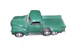 Green diecast pickup truck with detailed grille and wheels, 1:36 scale.