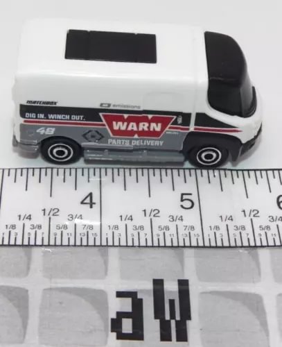 Diecast matchbox car, white body with black roof and WARN graphic