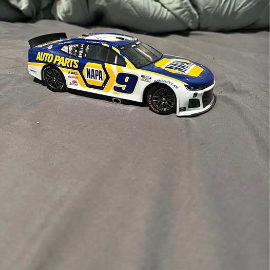 Diecast Lincoln DE race car, blue with yellow accents, number 9, black wheels
