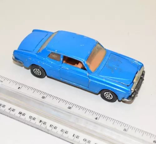 Vintage diecast toy car, blue body with chrome grille and wheels