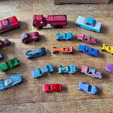 Assorted colorful diecast toy cars, multiple vehicles shown together