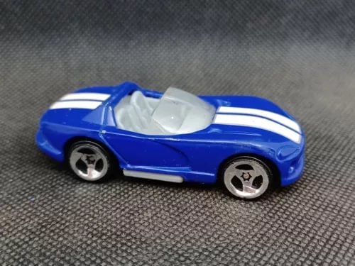 Blue diecast convertible car with white racing stripes and chrome wheels