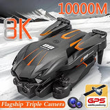 Black quadcopter drone with orange accents, camera module on top and front