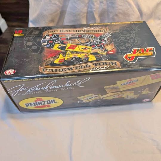 Diecast model box with racing logos and Pennzoil, JAC, and Pennzoil branding