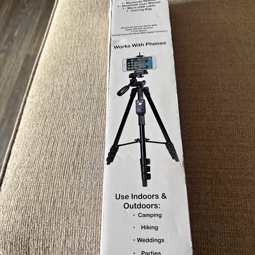 Black phone and camera tripod with remote, adjustable legs and mounting clip