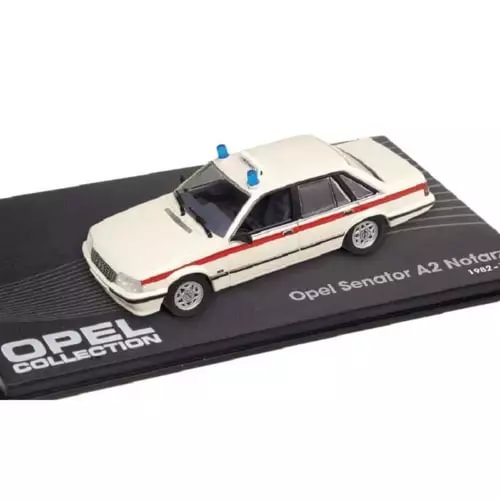 White diecast model ambulance car with red stripe, blue roof lights, Opel Senator A2