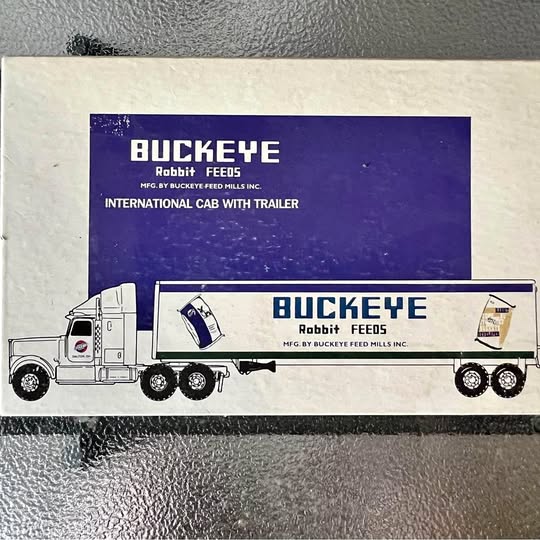 White diecast cab with trailer, Buckeye Rabbit Feeds graphic, two-axle wheels.