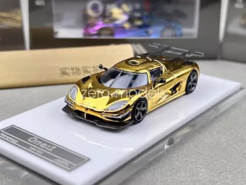 Gold electroplated 1:64 racing sports diecast car toy, front three-quarter view