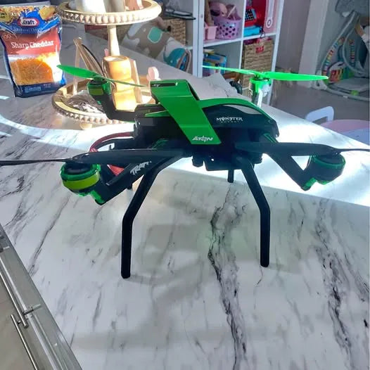 Traxxas Aton quadcopter drone with green arms and black body