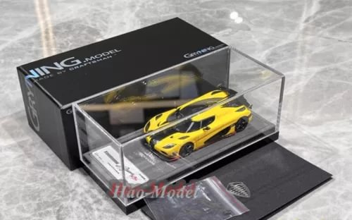 Yellow Koenigsegg Agera RS1 diecast model car in clear display box with black base