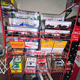 Diecast car collection display rack with multiple cars and Coca-Cola branding