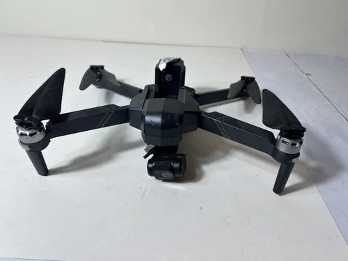 Gray quadcopter camera drone with four propellers and two-axis gimbal