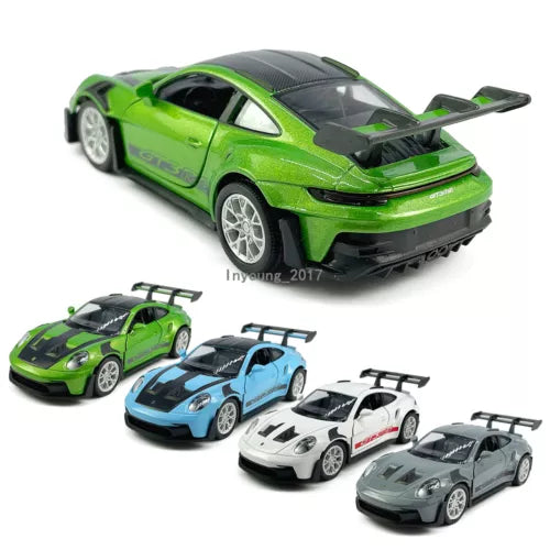 Green diecast model car with rear wing and detailed racing decals