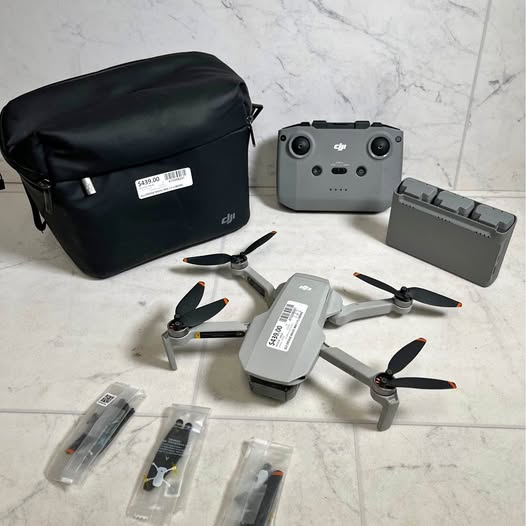 DJI Mavic Mini 2 drone kit with controller, drone, props and black carry case