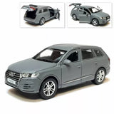Gray diecast SUV model car, front three-quarter view, detailed wheels and grille