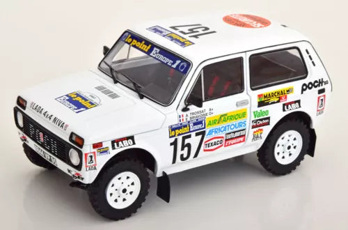 White off-road rally diecast model car with number 15 decals and black tires
