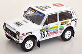 White off-road rally diecast model car with number 15 decals and black tires