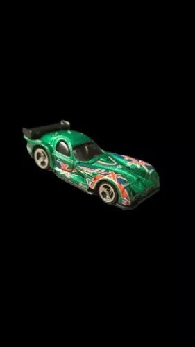 Green race car diecast model with open wheels