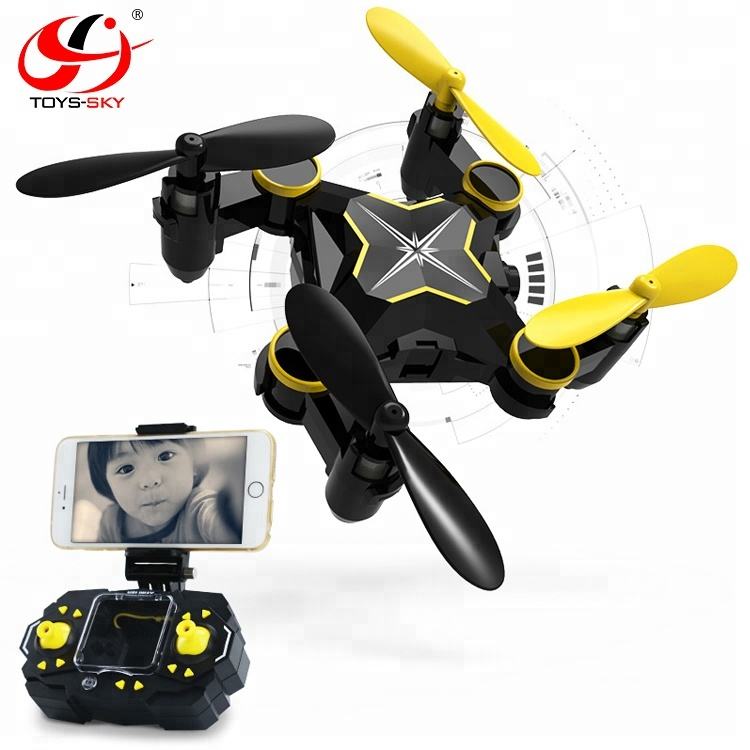 Foldable mini quadcopter drone with yellow propellers, camera, and handheld controller