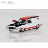 Red and white diecast panel van toy model, black hood, front three-quarter view