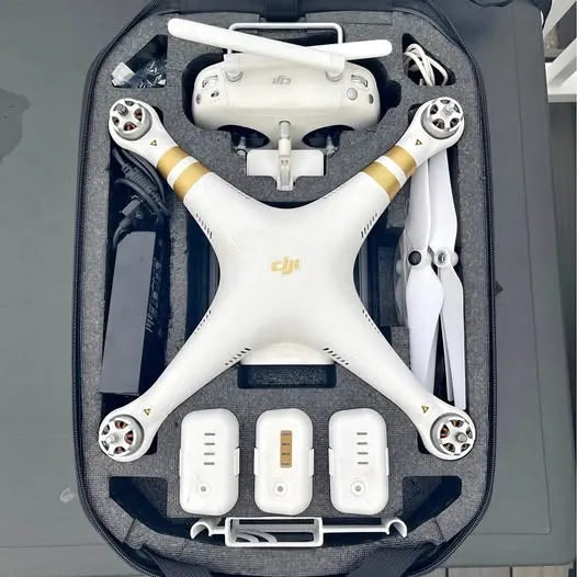 DJI Phantom 3 drone in gray carrying case, white body and propeller arms visible