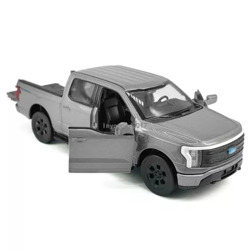 Gray diecast toy pickup truck with open doors, pull-back model car