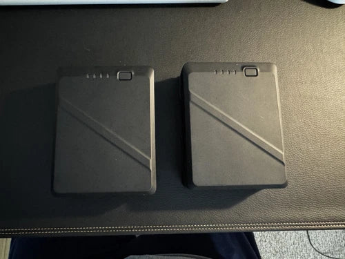 DJI TB51 intelligent battery pack with indicator on two dark gray units
