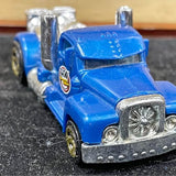 2014 Hot Wheels 1:64 die-cast vehicle, blue front with chrome grille and headlights