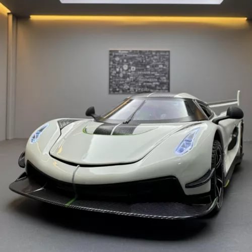 White Koenigsegg Jesko diecast car model, front view, 1:24 scale, detailed body