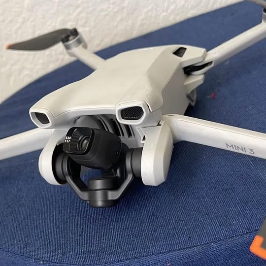 White drone with front camera gimbal and dual front sensors, Mini 3